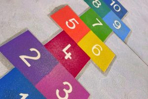 Playground games for primary school students on a colourful thermoplastic marked court in Australia