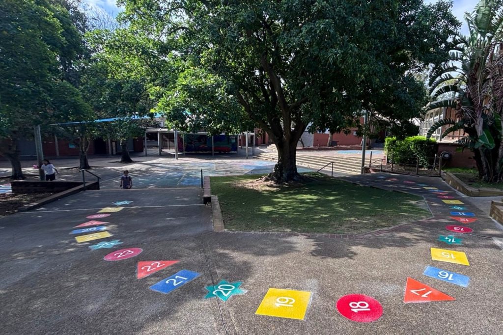 The Best Playground Games for Primary School Students in Australia 1 Primary school students playing structured playground games on thermoplastic line markings in Australia