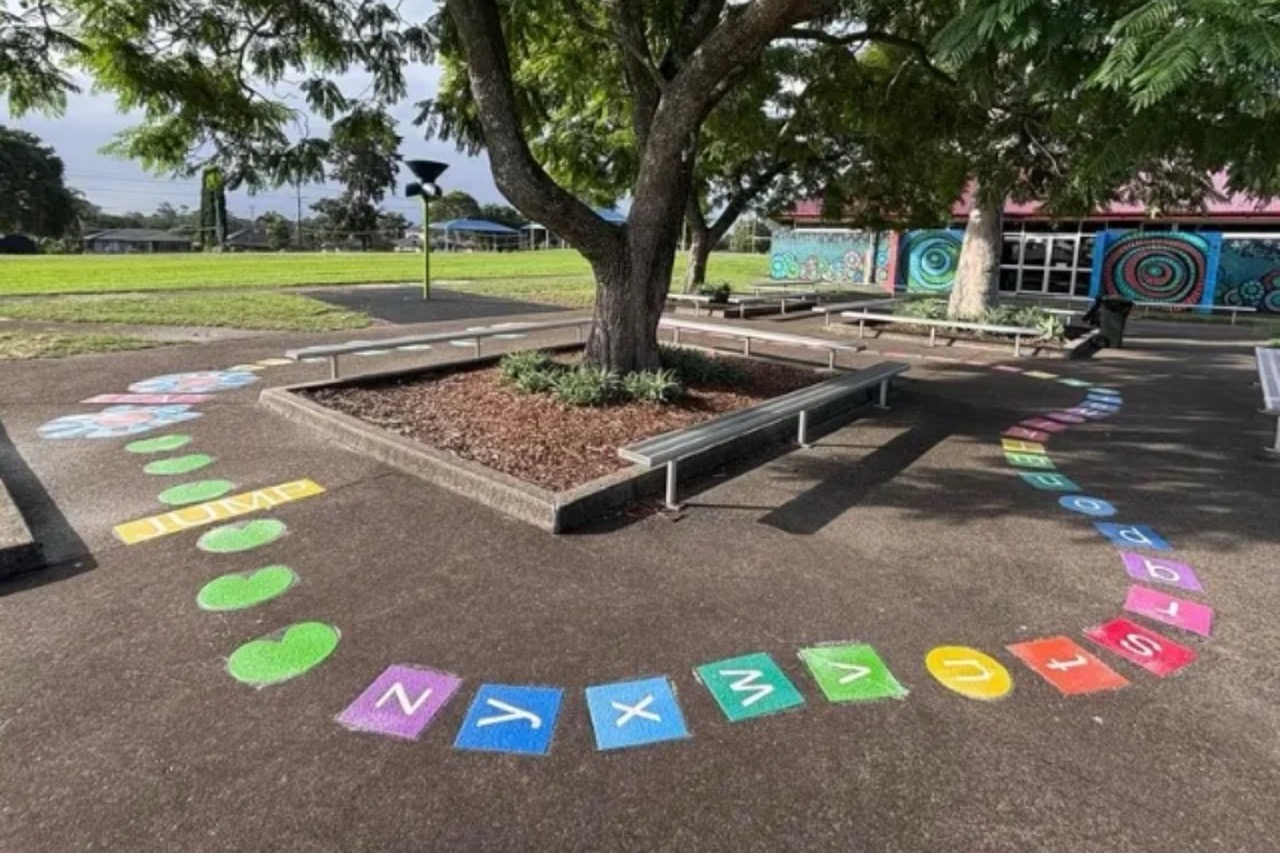 Outdoor play equipment for a primary school playground in Australia showing diverse equipment zones